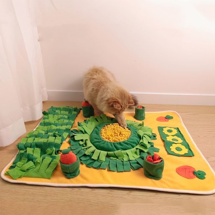 cat which is playing with snuffle mat